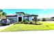 Charming single-story home boasts a well-manicured lawn, stone flower beds, two-car garage, and a tidy driveway at 3907 Golden Knot Dr, Kissimmee, FL 34746
