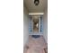 Inviting foyer with gray tiled floors and decorative sidelights flanking the front door, leading to a spacious interior at 3907 Golden Knot Dr, Kissimmee, FL 34746