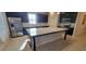 Modern kitchen with stainless steel appliances and a large granite island at 3907 Golden Knot Dr, Kissimmee, FL 34746