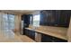 Kitchen with dark cabinets, granite counter tops, and stainless steel appliances at 3907 Golden Knot Dr, Kissimmee, FL 34746