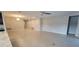 Large open living room with tile flooring, recessed lights, and neutral-colored walls, ready for your personal touch at 3907 Golden Knot Dr, Kissimmee, FL 34746