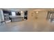 Spacious living room and kitchen area with tile flooring and a large island at 3907 Golden Knot Dr, Kissimmee, FL 34746