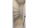 Walk-in pantry with white wire shelving and a tiled floor at 3907 Golden Knot Dr, Kissimmee, FL 34746