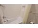 Clean shower featuring white tile surround, soap nook, and chrome fixtures at 3907 Golden Knot Dr, Kissimmee, FL 34746