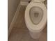 Close up of a toilet showcasing the clean lines of the toilet bowl and the neutral-toned tiled floor at 3907 Golden Knot Dr, Kissimmee, FL 34746
