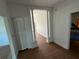 Bright entryway with white walls, wood floors, decorative columns, and a closet at 701 1St Ne St, Fort Meade, FL 33841