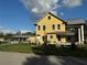 Charming yellow house with a large covered porch and a metal roof at 701 1St Ne St, Fort Meade, FL 33841