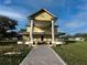 Grand two-story home featuring a large wrap-around porch and stately columns at 701 1St Ne St, Fort Meade, FL 33841