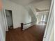 Hallway with wood flooring, white walls, and natural light at 701 1St Ne St, Fort Meade, FL 33841