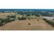 Aerial view of expansive land with pond and trees at 8836 Sr 471 Hwy, Webster, FL 33597