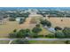 Aerial view showing large property with a home and surrounding pasture at 8836 Sr 471 Hwy, Webster, FL 33597