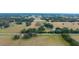 Aerial view of property near a road, showing fields and trees at 8836 Sr 471 Hwy, Webster, FL 33597