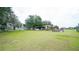 Spacious backyard with covered patio, hot tub, and lush grass at 8836 Sr 471 Hwy, Webster, FL 33597