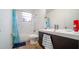 Clean bathroom with tub shower, vanity, and wood-look tile at 8836 Sr 471 Hwy, Webster, FL 33597