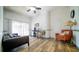 Relaxing bedroom with a comfortable sitting area and wood-look floors at 8836 Sr 471 Hwy, Webster, FL 33597
