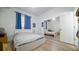 Bright bedroom with mirrored closet doors and wood-look floors at 8836 Sr 471 Hwy, Webster, FL 33597