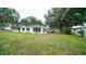 Ranch home with white brick exterior and large windows at 8836 Sr 471 Hwy, Webster, FL 33597