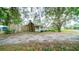 Brick house with stone accents, covered porch, and mature trees at 8836 Sr 471 Hwy, Webster, FL 33597