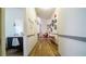 Long hallway with light walls and vinyl wood flooring at 8836 Sr 471 Hwy, Webster, FL 33597