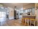 Open kitchen featuring stainless steel appliances and breakfast bar at 8836 Sr 471 Hwy, Webster, FL 33597