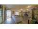 Cozy living room featuring a stone fireplace and hardwood floors at 8836 Sr 471 Hwy, Webster, FL 33597