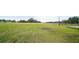 Spacious pasture with trees and a wooden fence at 8836 Sr 471 Hwy, Webster, FL 33597