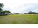 Large grassy pasture with RV and trees in the background at 8836 Sr 471 Hwy, Webster, FL 33597