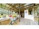 Large covered patio with comfortable seating and a TV at 8836 Sr 471 Hwy, Webster, FL 33597