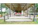 Covered patio features a seating area and outdoor bar at 8836 Sr 471 Hwy, Webster, FL 33597