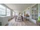 Spacious sunroom with a dining table and large windows at 8836 Sr 471 Hwy, Webster, FL 33597