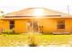 Home exterior featuring solar panels, sliding glass door and windows at 1053 Hemingway Dr, Deltona, FL 32725