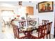 Features a glass dining table with ornate chairs adjacent to the kitchen, perfect for Gathering gatherings at 1053 Hemingway Dr, Deltona, FL 32725