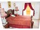 Bright bedroom is well-lit with a large bed, window and curtains at 1053 Hemingway Dr, Deltona, FL 32725