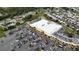 Overhead shot of a commercial retail building shows the parking lot filled with cars at 2112 Fish Eagle St, Clermont, FL 34714