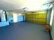 Spacious garage featuring an epoxy floor and water heater at 2112 Fish Eagle St, Clermont, FL 34714