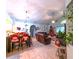Spacious living room with open floor plan is decorated with Christmas decorations and features tile flooring at 2112 Fish Eagle St, Clermont, FL 34714