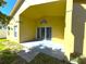 Covered outdoor patio with sliding glass doors to the backyard at 2112 Fish Eagle St, Clermont, FL 34714