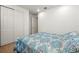 Neutral bedroom featuring a patterned bedspread and carpeted floors at 3878 Carrick Bend Dr, Kissimmee, FL 34746