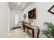Inviting foyer featuring a decorative glass door, elegant console table, and stylish decor at 3878 Carrick Bend Dr, Kissimmee, FL 34746