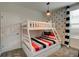 Fun bunk bed with black and red striped bedding, and Mickey Mouse accents at 712 Whistling Straits Blvd, Davenport, FL 33896