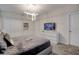 Modern bedroom features a gray color palette, recessed lighting, and a stylish geometric light fixture at 712 Whistling Straits Blvd, Davenport, FL 33896