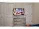 Cozy bedroom features Spiderman themed bedding, neutral dresser, and closet at 712 Whistling Straits Blvd, Davenport, FL 33896