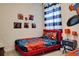 Bright bedroom with Spiderman themed bedding, artwork and wall decor at 712 Whistling Straits Blvd, Davenport, FL 33896