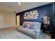 Bonus room featuring Star Wars decor, a comfortable sofa, and a popcorn machine for Gathering entertainment at 712 Whistling Straits Blvd, Davenport, FL 33896