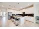 Spacious kitchen with a center island, stainless steel appliances, and modern white cabinetry at 712 Whistling Straits Blvd, Davenport, FL 33896