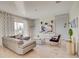 Stylish living room with comfortable seating, contemporary decor, and sliding glass doors at 712 Whistling Straits Blvd, Davenport, FL 33896