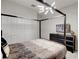 Well-lit bedroom with modern furnishings, patterned bedding, and a large window at 712 Whistling Straits Blvd, Davenport, FL 33896