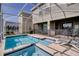 Beautiful pool and hot tub, perfect for relaxing and entertaining with an extended patio at 712 Whistling Straits Blvd, Davenport, FL 33896