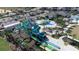 Aerial view of a vibrant community water park featuring thrilling slides and play areas for all ages at 712 Whistling Straits Blvd, Davenport, FL 33896