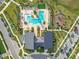 Overhead shot of community amenities including a pool, playground, and modern clubhouse, promoting an active lifestyle at 11720 Language Way, Orlando, FL 32832